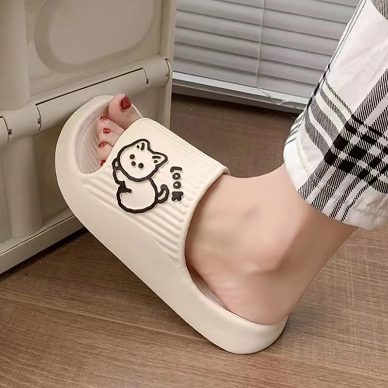 Women's green cat slippers with thick platform sole and flip-flop design.