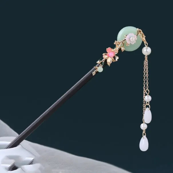 Chinese ancient style floral alloy hairpin with electroplated finish on dark background