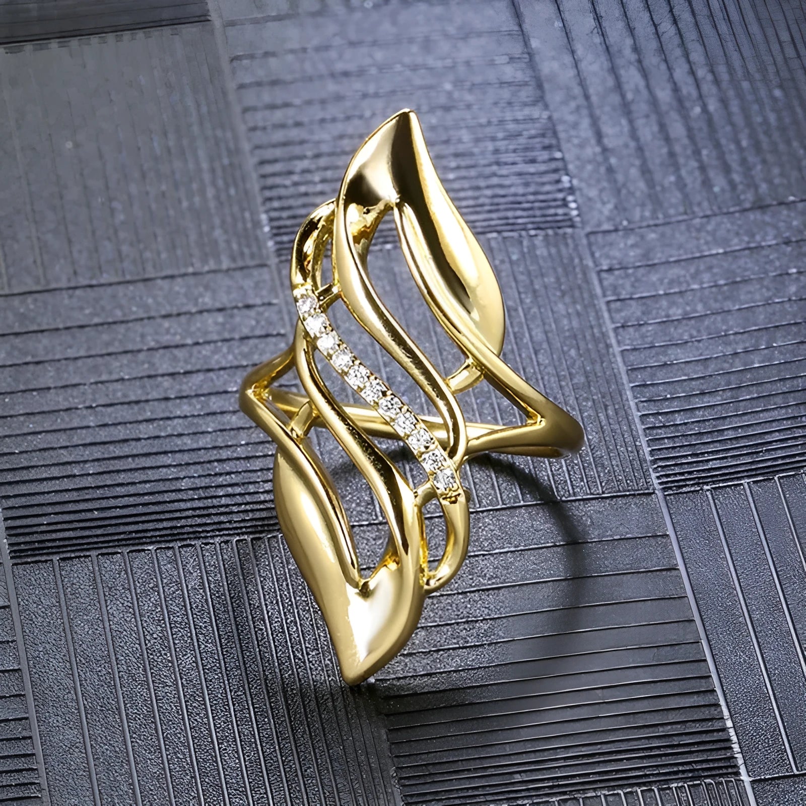 Gold copper women's ring with exaggerated curve silhouette and zircon sparkle on finger