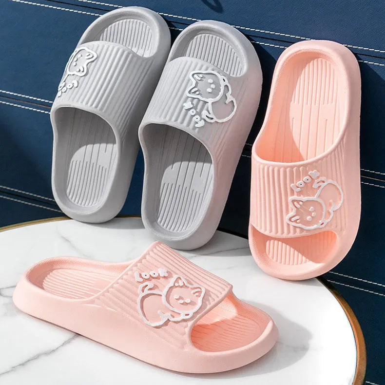 Women's green cat slippers with thick platform sole and flip-flop design.