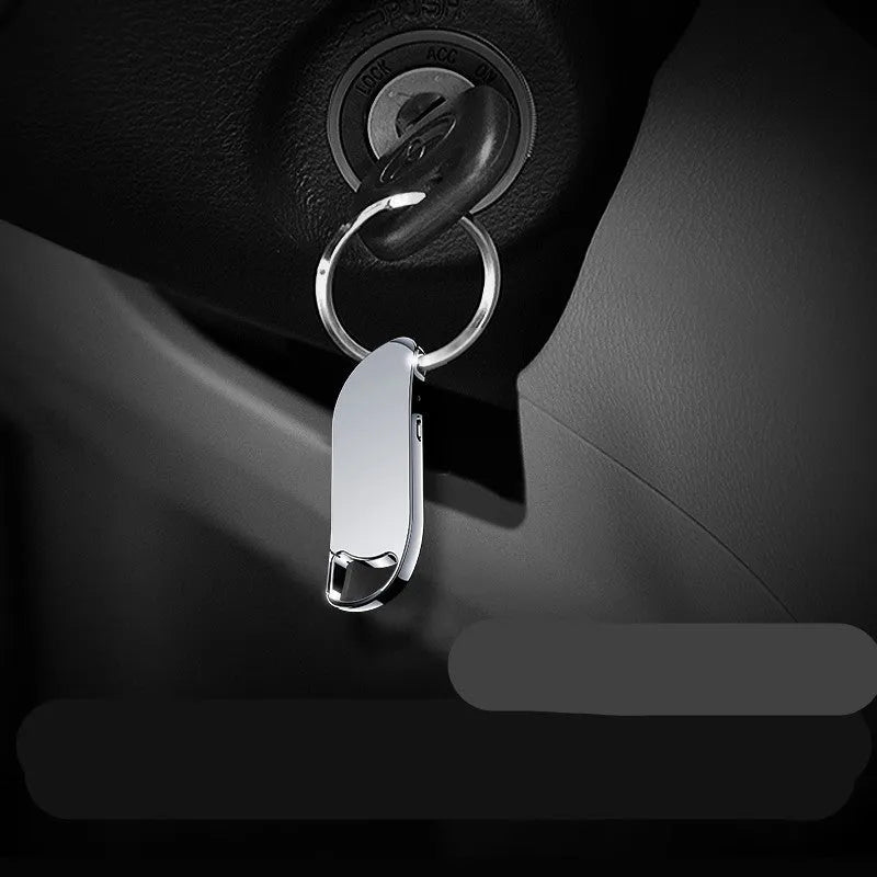 Keychain digital voice recorder in silver metal shell with keyring attachment