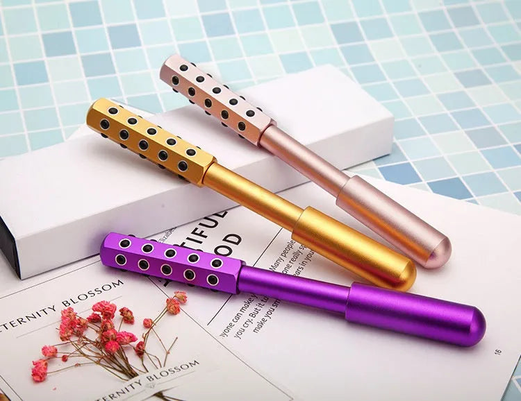 Germanium particles facial massage roller with purple handle and 24 rolling balls