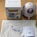 Purple astronaut-shaped USB desktop humidifier with colourful LED lights showing 220ml water capacity