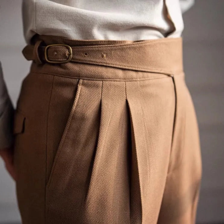 Man wearing black high waist straight leg casual trousers made from polyester fabric.