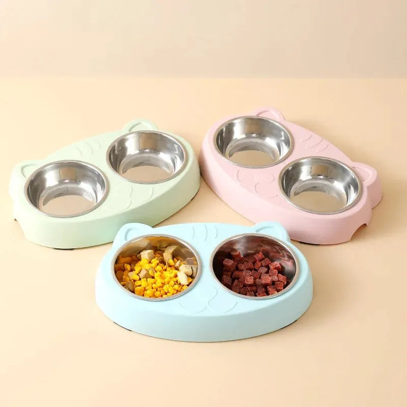 Blue macaron-shaped plastic pet feeder with two bowls for cat food and water