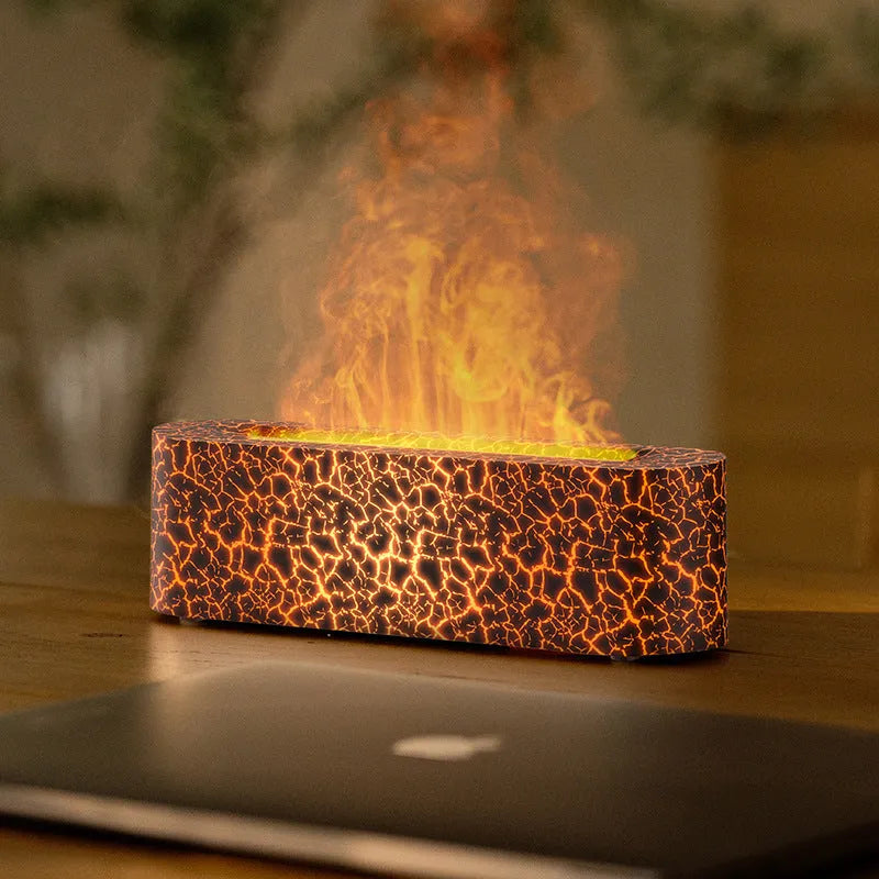 Square black creative lava USB humidifier and aroma diffuser with colourful LED flame lighting on a desk.