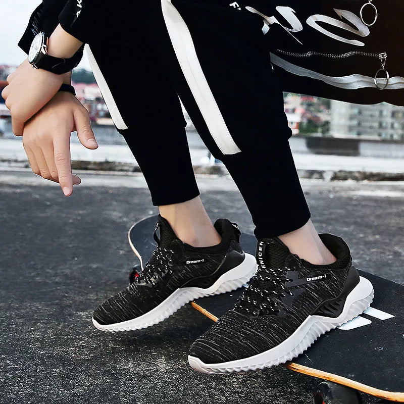 Low-top adult running shoes in a plain style with a front strap and mesh upper.