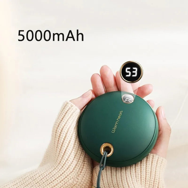 Green 5000mAh power bank with hand warmer function showing digital display, measuring 89.5mm square