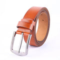 Leather pin buckle belt in black and camel colours on a plain background