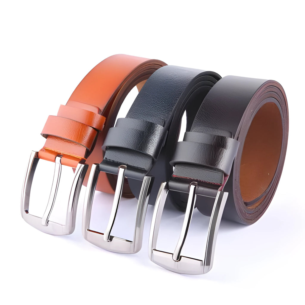 Leather pin buckle belt in black and camel colours on a plain background