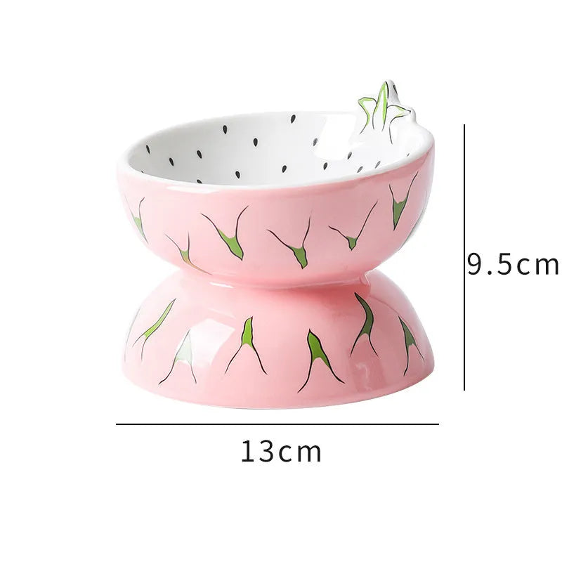 Orange patterned ceramic elevated cat bowl on a white surface