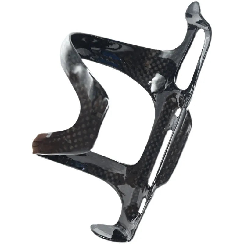 Black carbon fibre bicycle water bottle cage showing mounting holes and bottle retention shape.