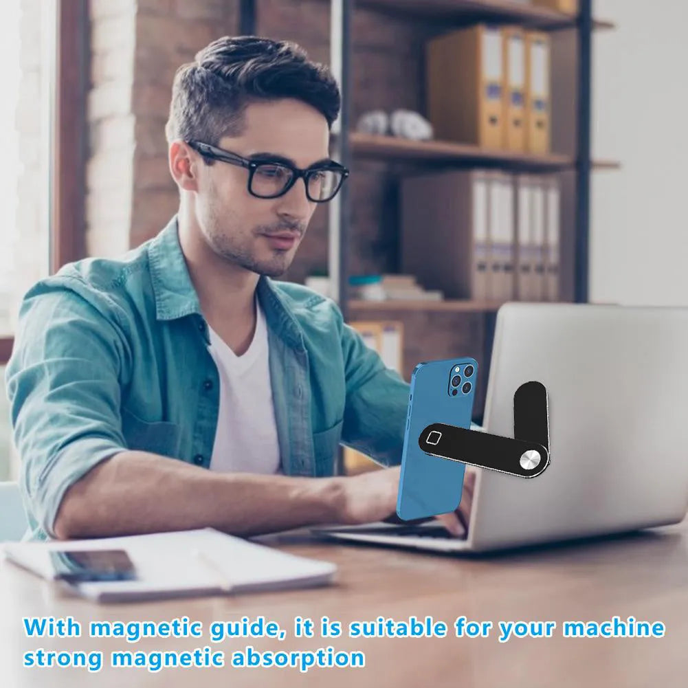 Black aluminium laptop phone holder with magnetic mount attached to a laptop screen.