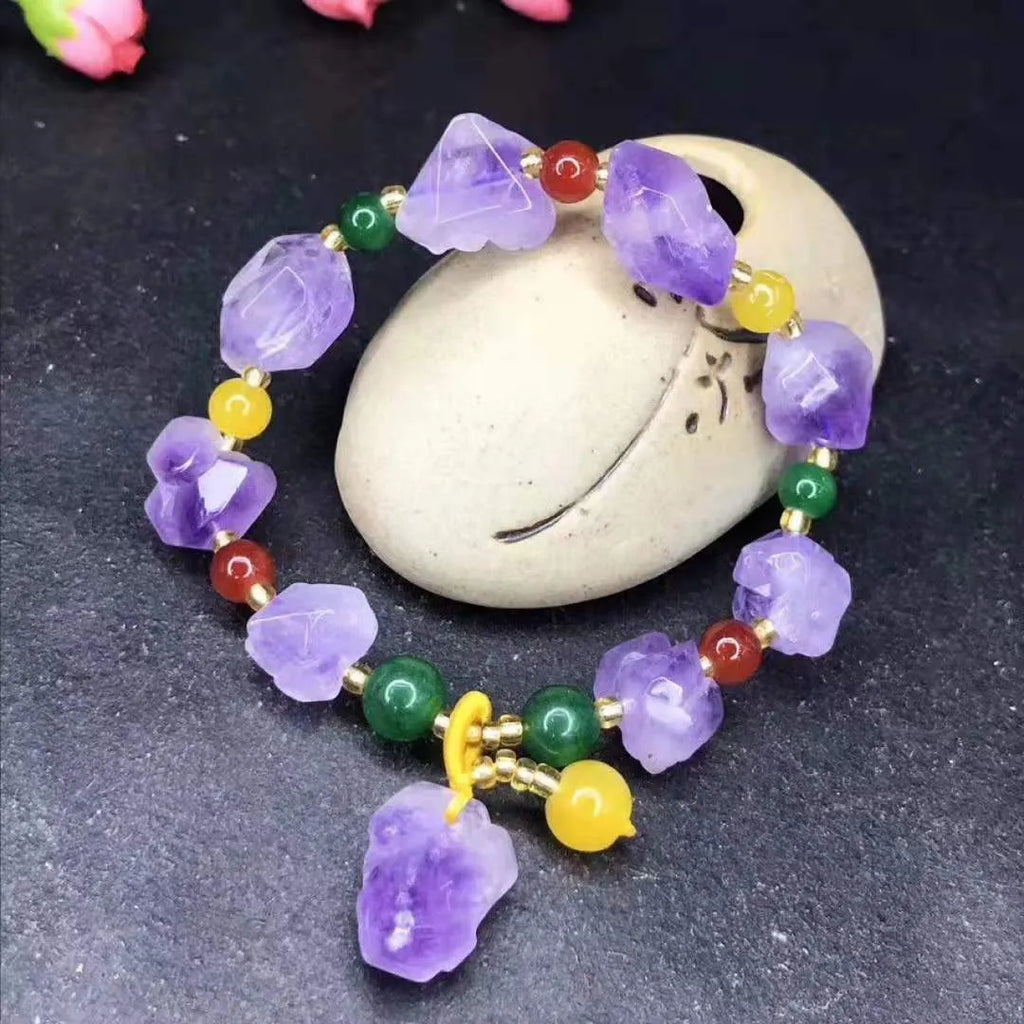 Natural shaped amethyst bead bracelet with fu character element on wrist