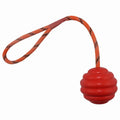 Rubber dog ball with rope knot in blue colour showing textured surface