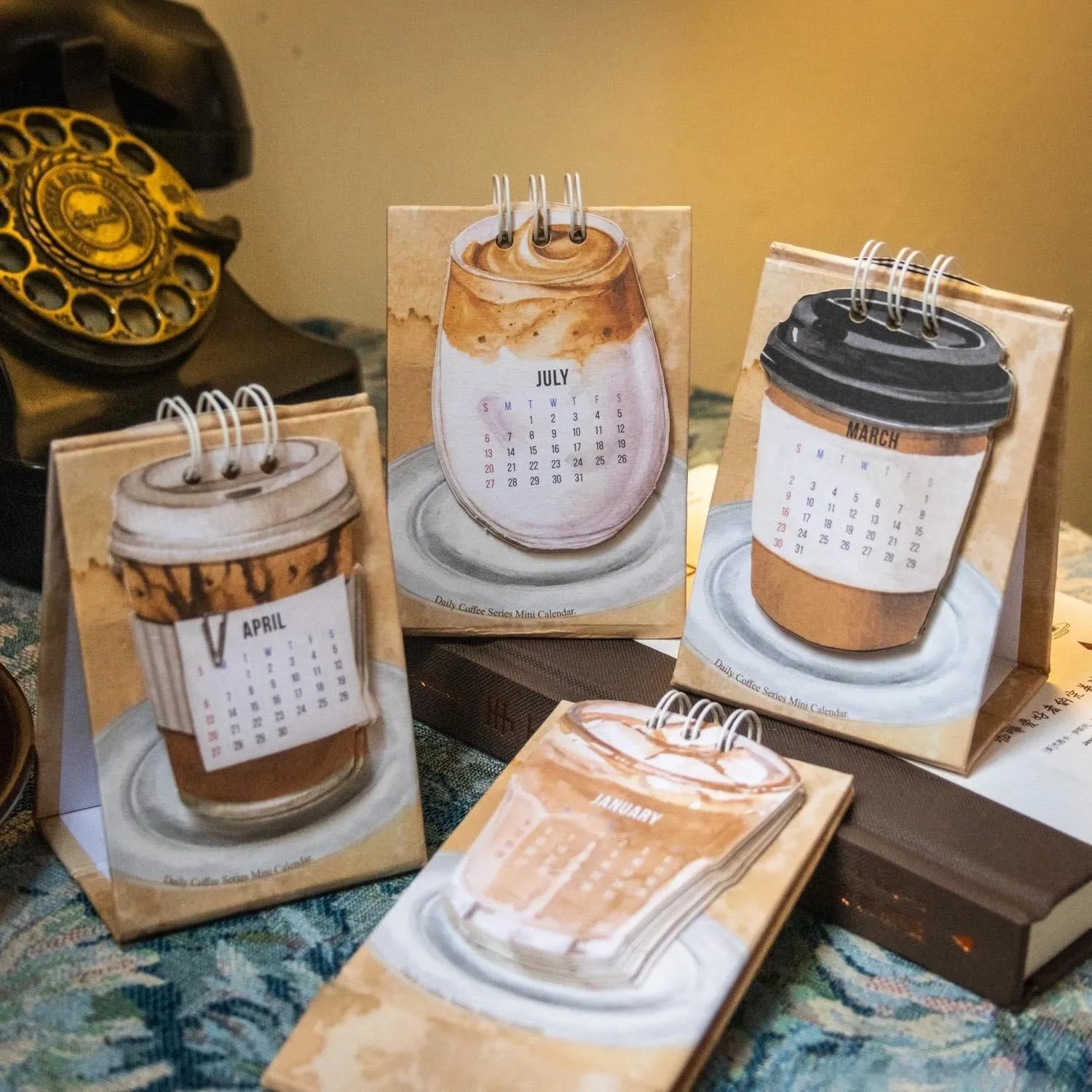 2025 mini desk calendar set showing ten different paper designs including Coffee Time and Life Is Not Easy.