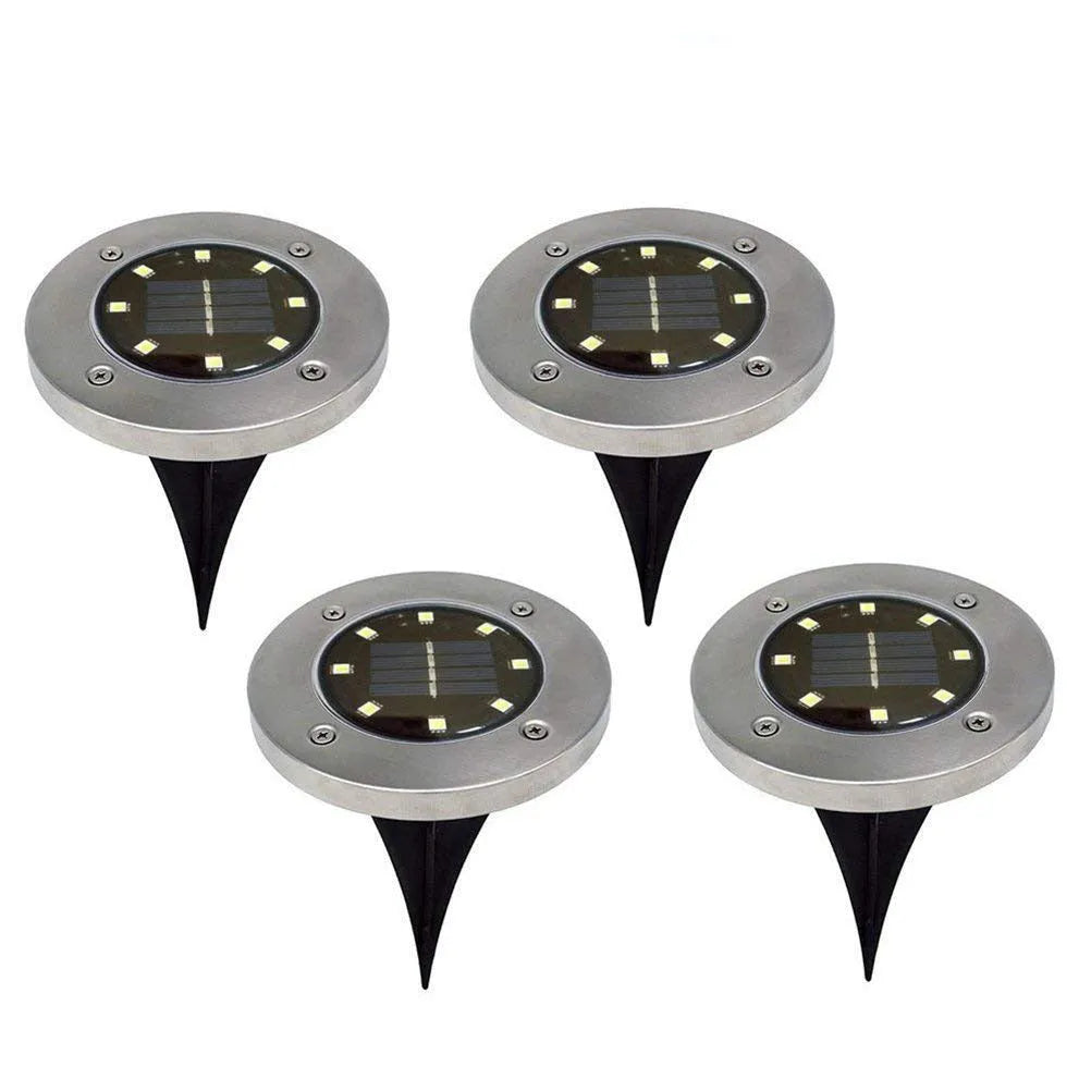 Four solar powered stainless steel lawn lights with LED, 12x12x13cm, warm white or white light option