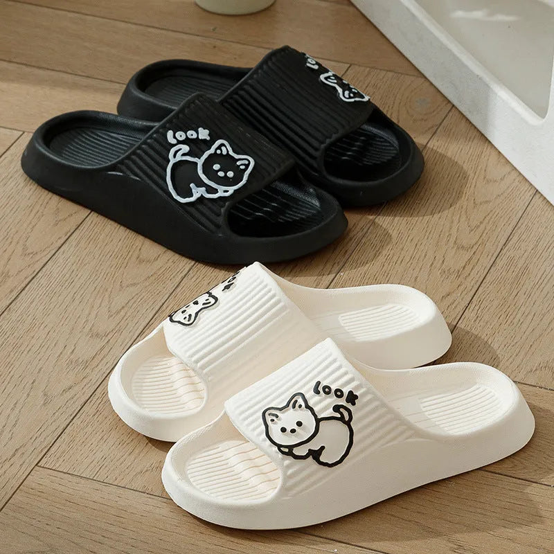 Women's green cat slippers with thick platform sole and flip-flop design.