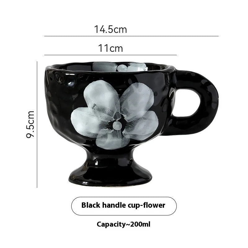 Hand-pinched irregular ceramic mug in a solid colour, shown from the side.