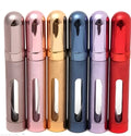 Slim 12ml aluminium and glass portable perfume bottle in multiple colours.