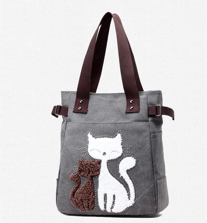 KVKY women canvas shoulder bag with cute plush cat applique in beige colour on white background