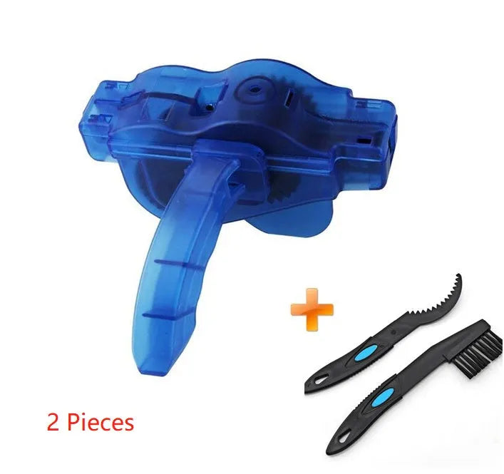 Blue plastic bicycle chain cleaning washer set with brushes on a bike chain