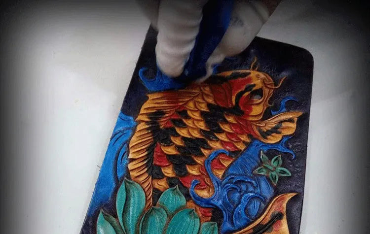 Men's carved leather short wallet in red, blue, or gold, showing open design.