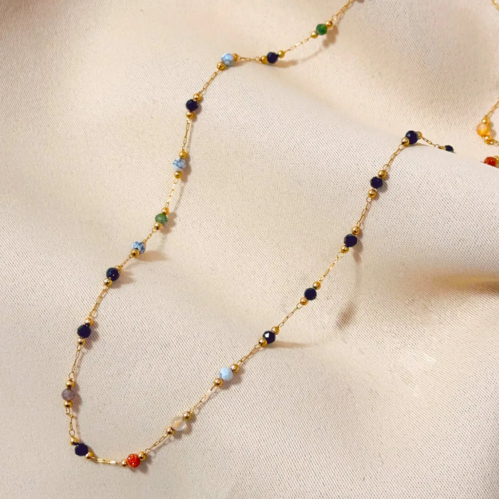 Gold titanium steel necklace with a natural stone pendant on an adjustable O-ring chain.