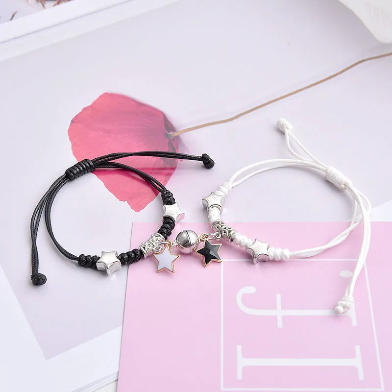 Alloy magnetic suction bracelet pair for couples with symbolic design options