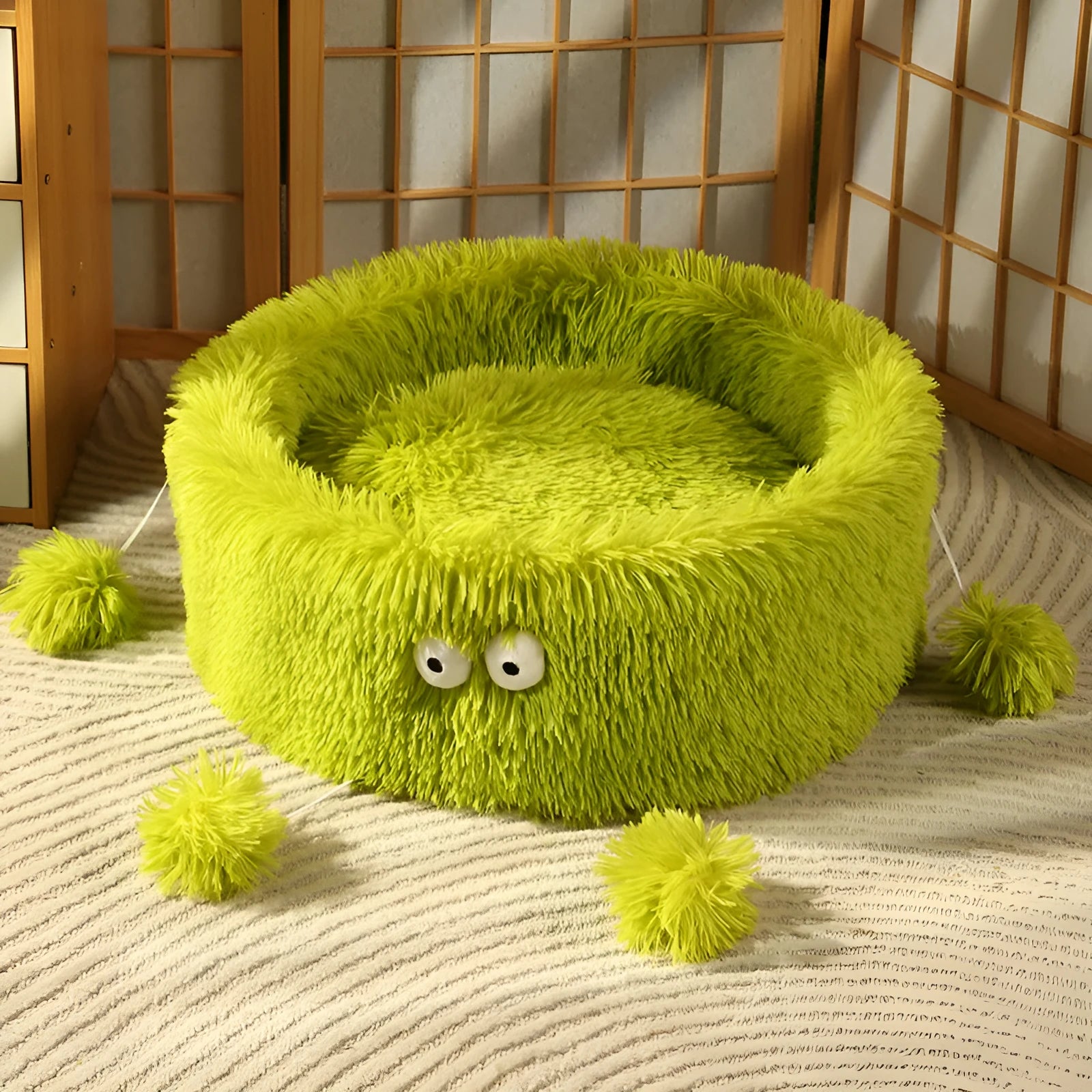 Round plush cat bed with cute small monster face pattern in green colour suitable for dogs and cats