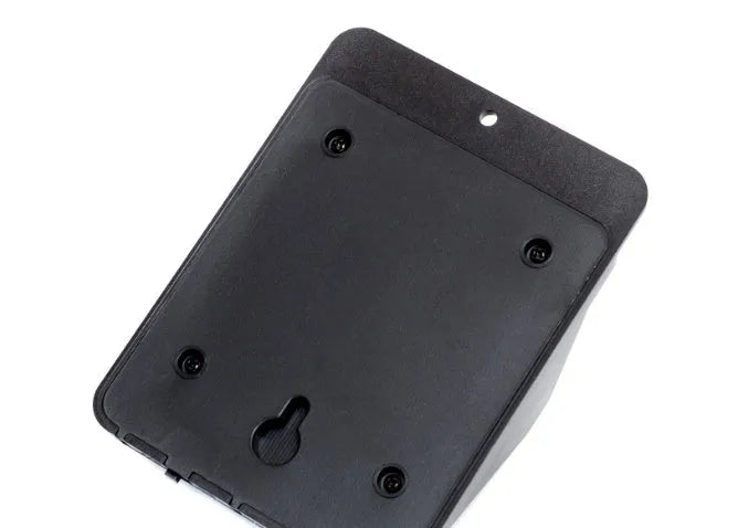 Outdoor solar powered light with 4 LEDs and motion sensor mounted on a garden wall