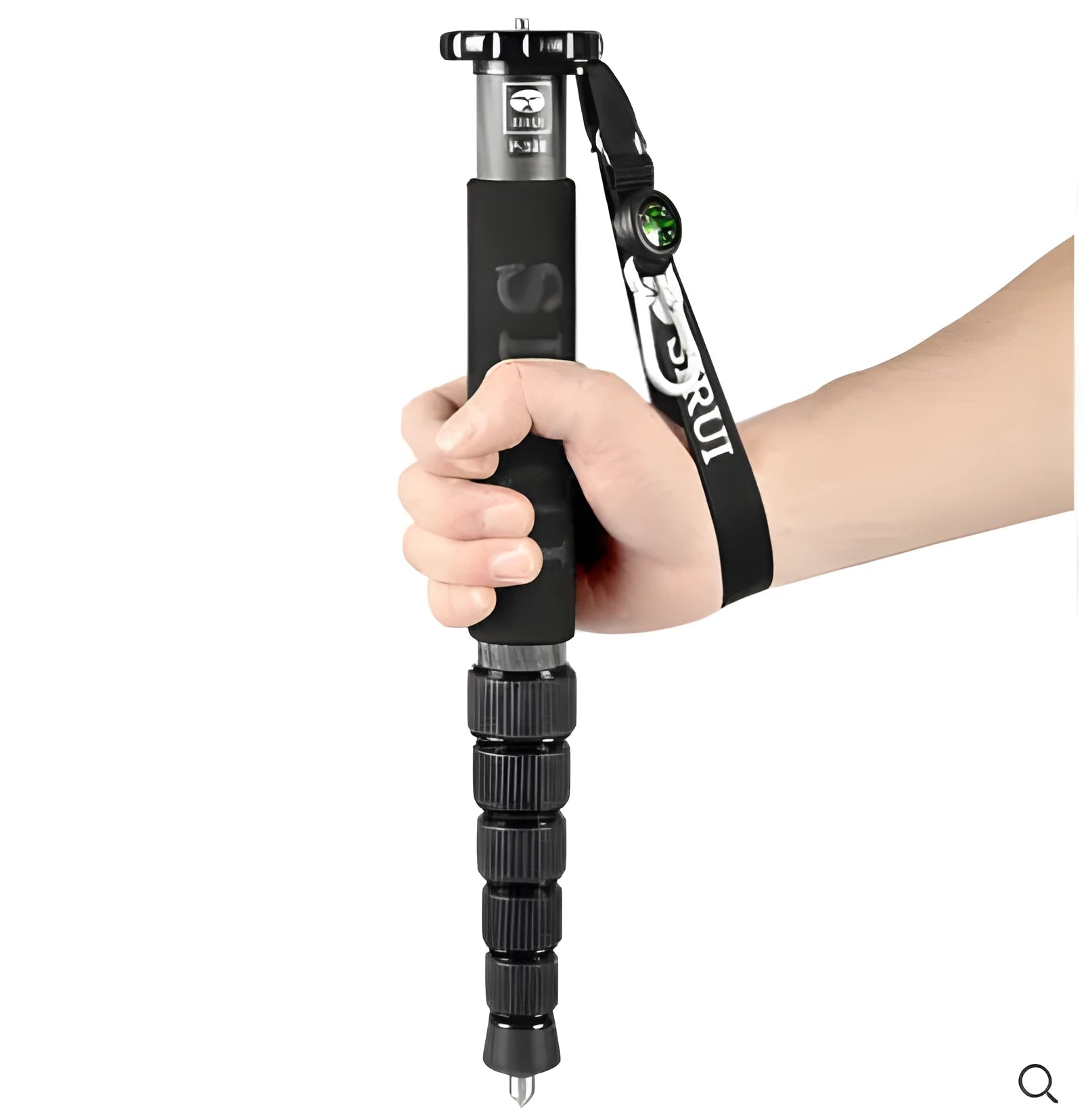 Black carbon fibre monopod for DSLR cameras extended to maximum height
