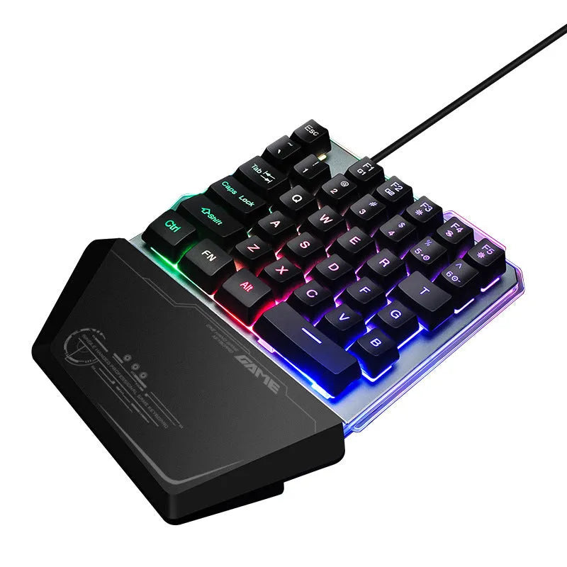 G40 Flow Colour black one-handed robotic keyboard with RGB backlit keys on a desk