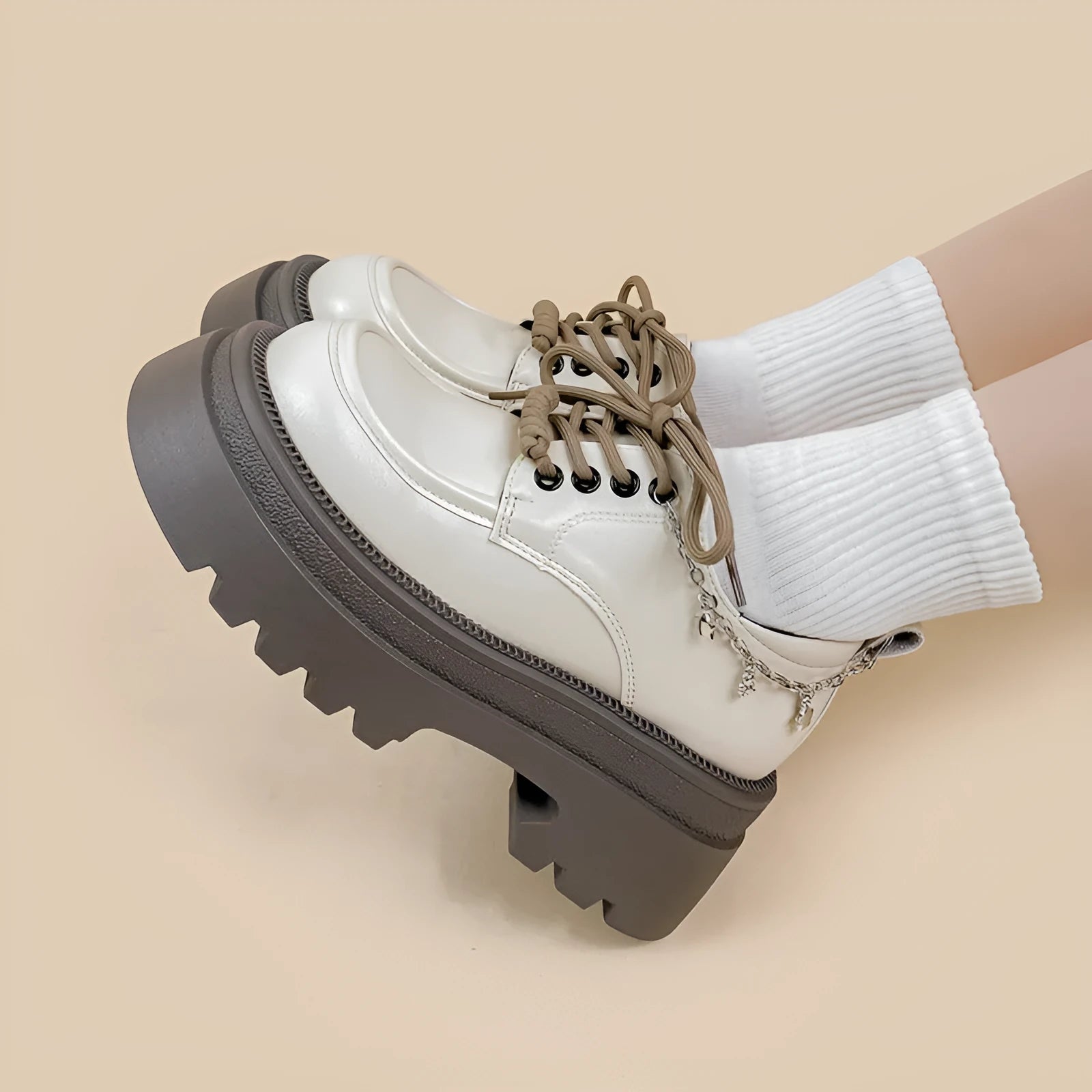 White PU platform Mary Jane shoes with thick chunky heel and front lace-up detail.