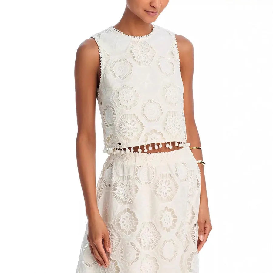 White women's retro style polyester suit with sleeveless top and embroidered long skirt.