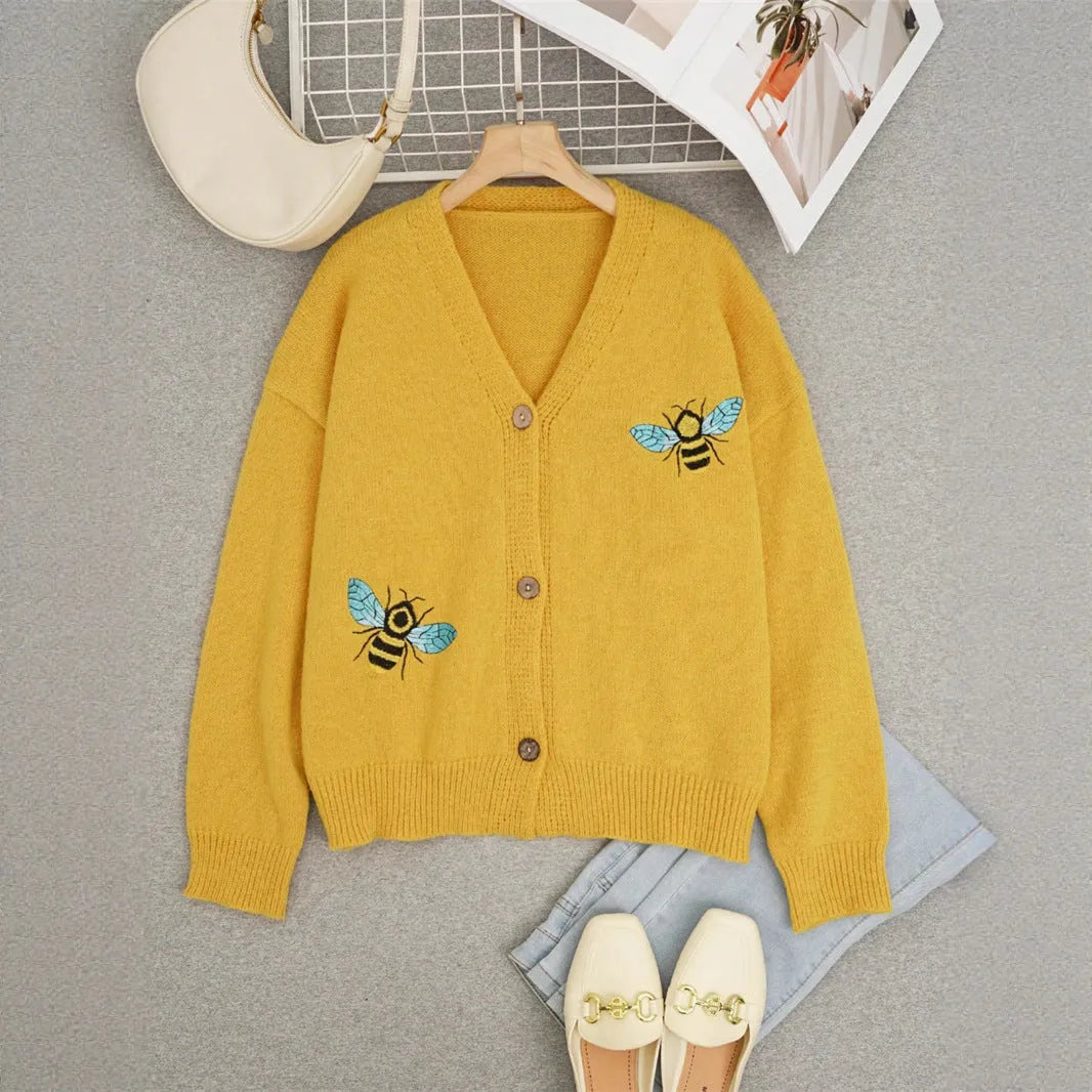 Loose fit animal pattern knitted cardigan sweater in black, made from polyester, with conventional sleeves.