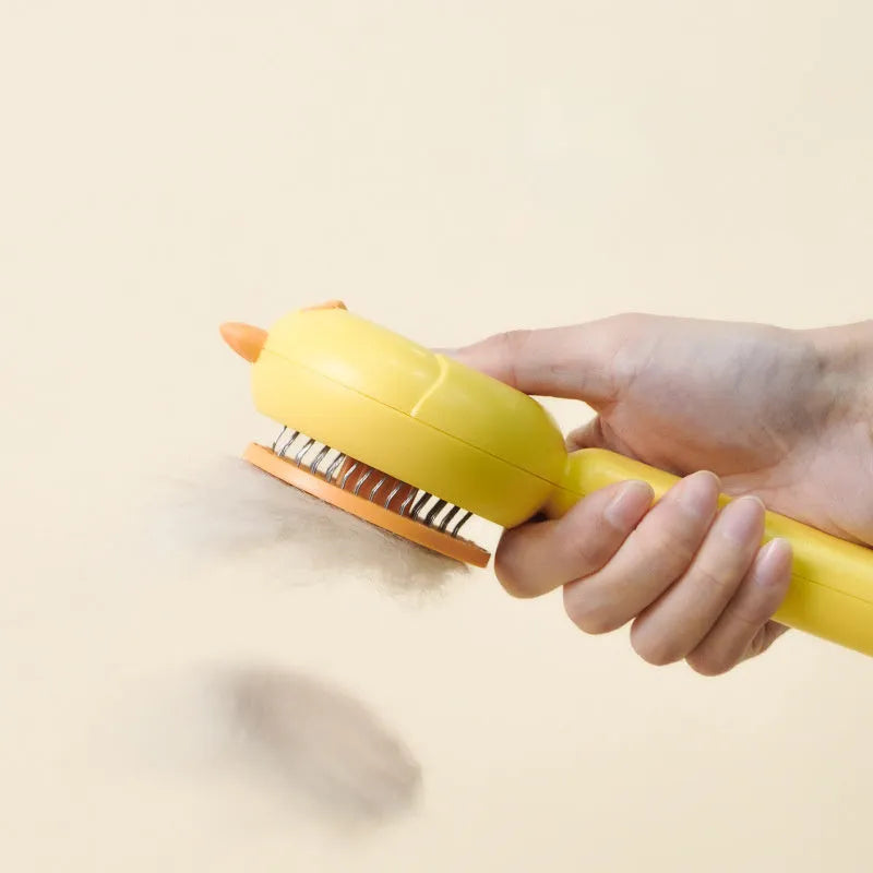 Pet grooming brush with self-cleaning feature and stainless steel bristles for cats and dogs