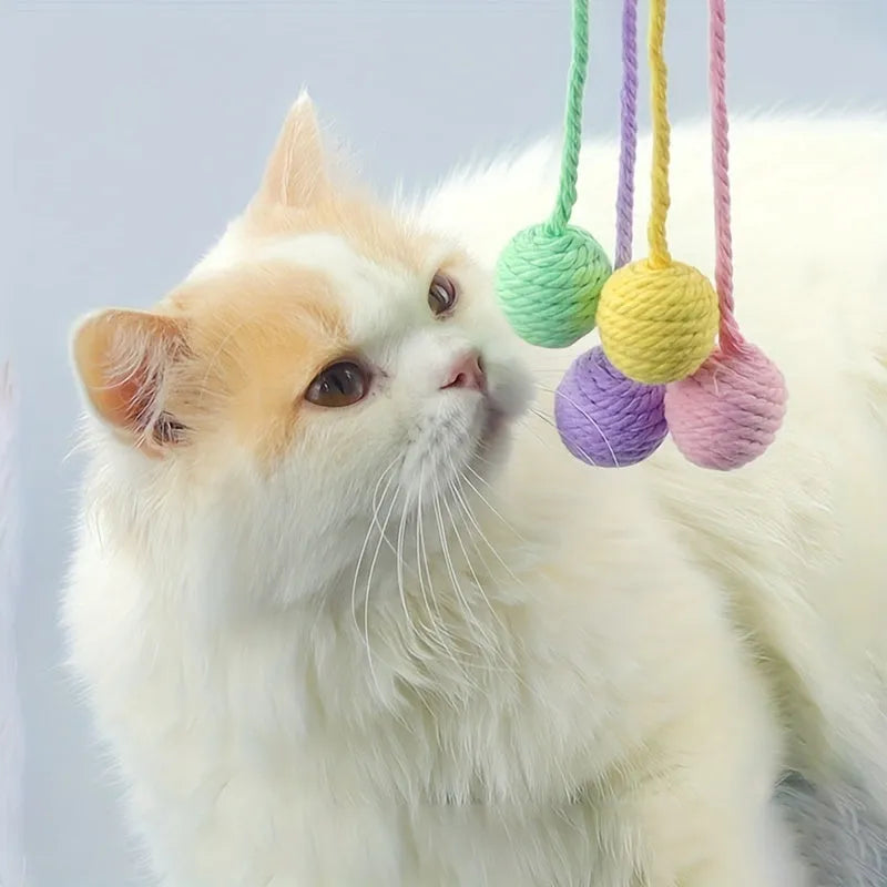 Cat toy ball with rope and bell in green pink purple yellow colours showing 3cm and 6cm size options