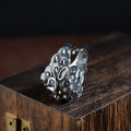 Silver open ring with detailed jibeast animal zodiac pattern showing adjustable retro design