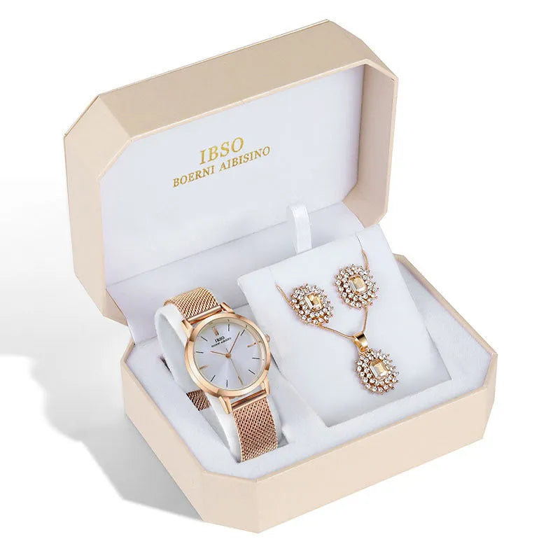 Women's quartz watch and jewellery set with 30mm dial, silver case, and stainless steel buckle, on a white background