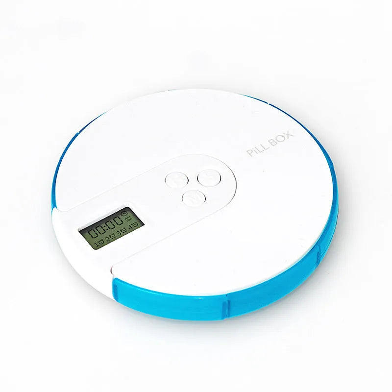 Blue 7-compartment alarm clock pill dispenser showing digital display and separate pill slots.