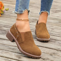 Women's light brown suede ankle boots with a low thick heel and elastic band fastening.