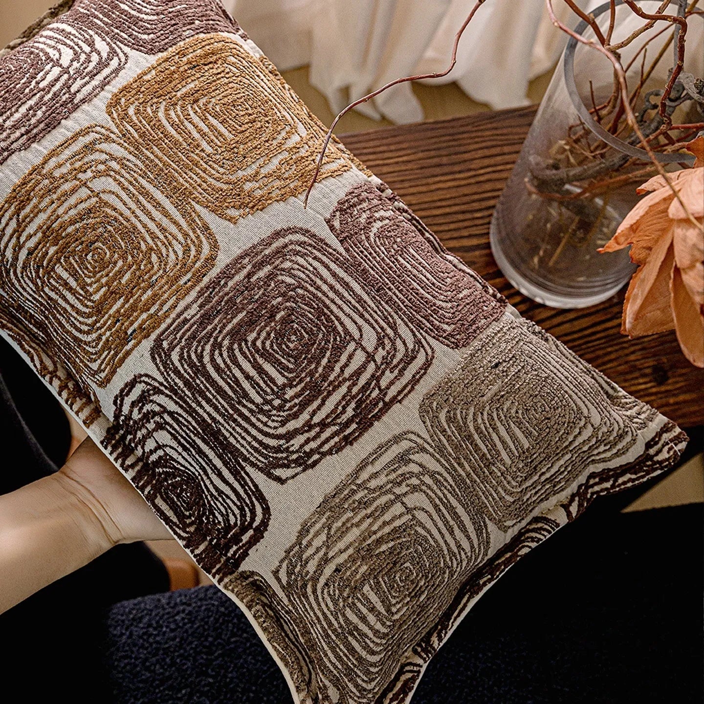 Square cream and coffee-coloured abstract coil pattern pillow cover, 50cm by 50cm.