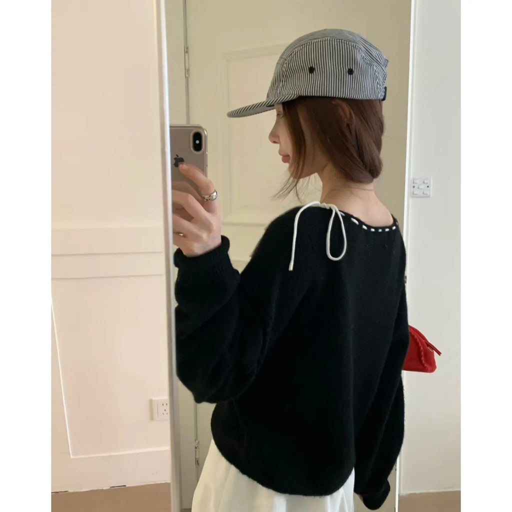Women's grey loose fit V-neck knitwear pullover jumper on hanger