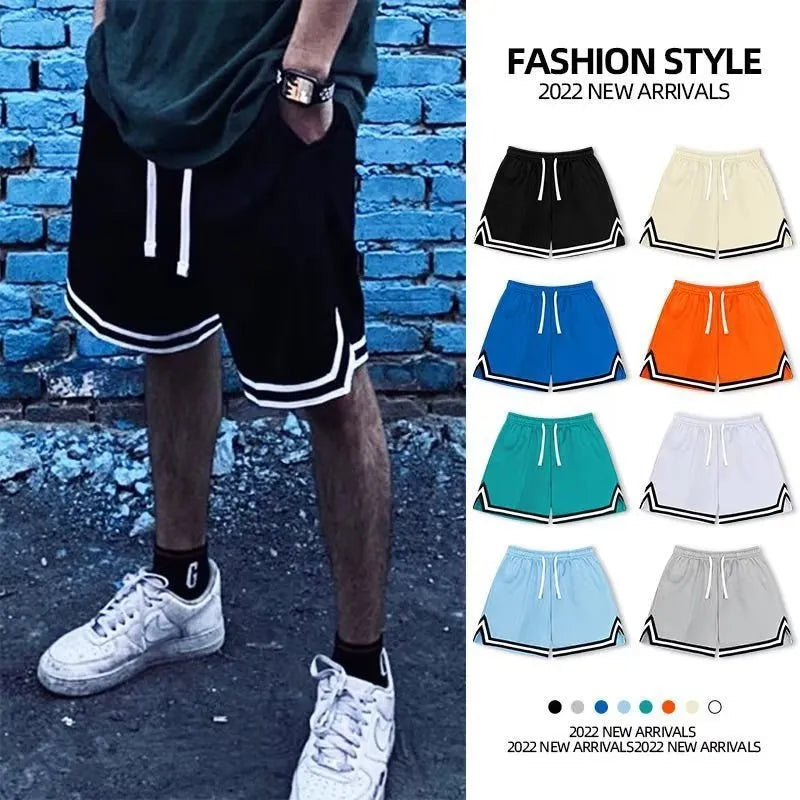 Men's loose polyester sports shorts in multiple colours on a size chart background.
