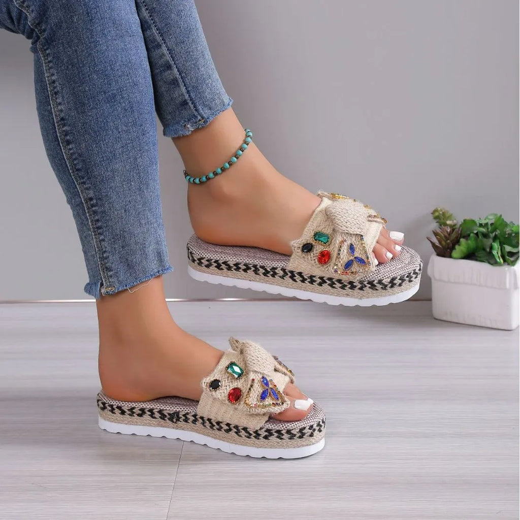 Women's beige platform sandals with bow detail, round toe and cloth upper, side view