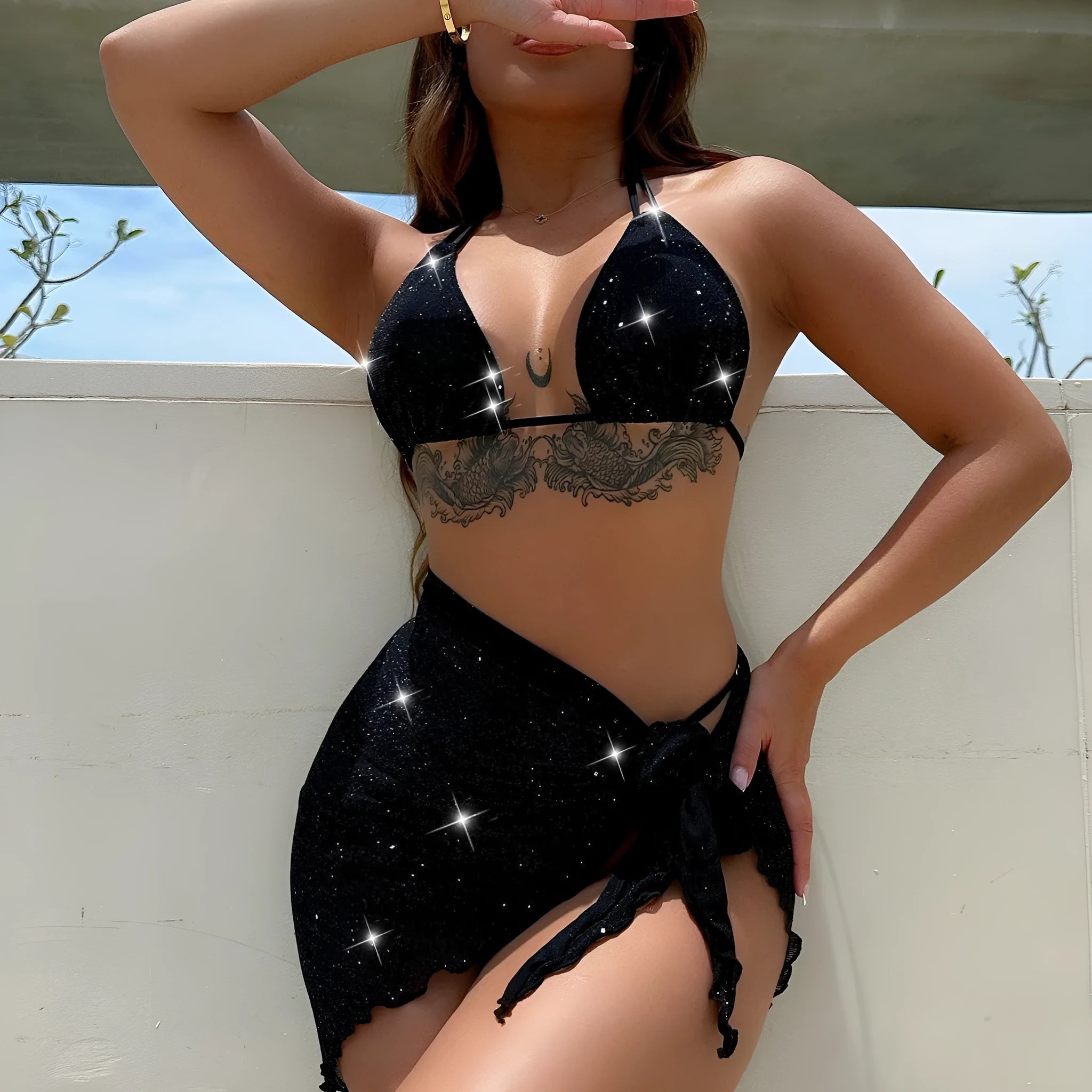 Black three-piece polyester bikini swimsuit set with top and shorts on mannequin