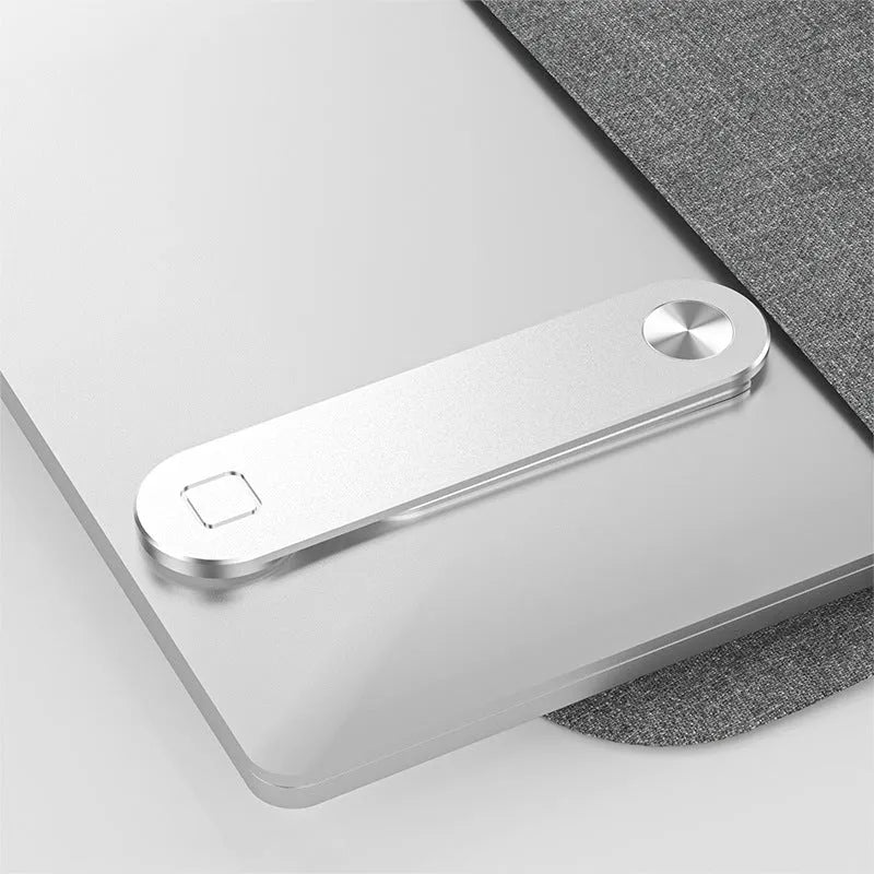Black aluminium laptop phone holder with magnetic mount attached to a laptop screen.