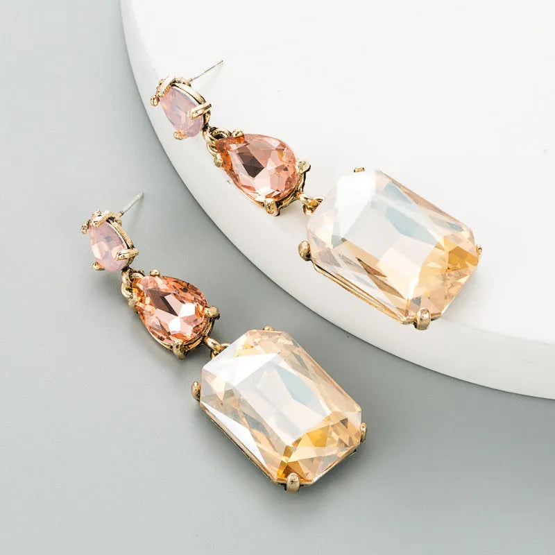 Geometric rhinestone earrings in a minimalist design with round shape, available in three colours