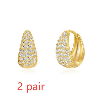 Brass geometric earclip earrings with electroplated gold finish and round design element